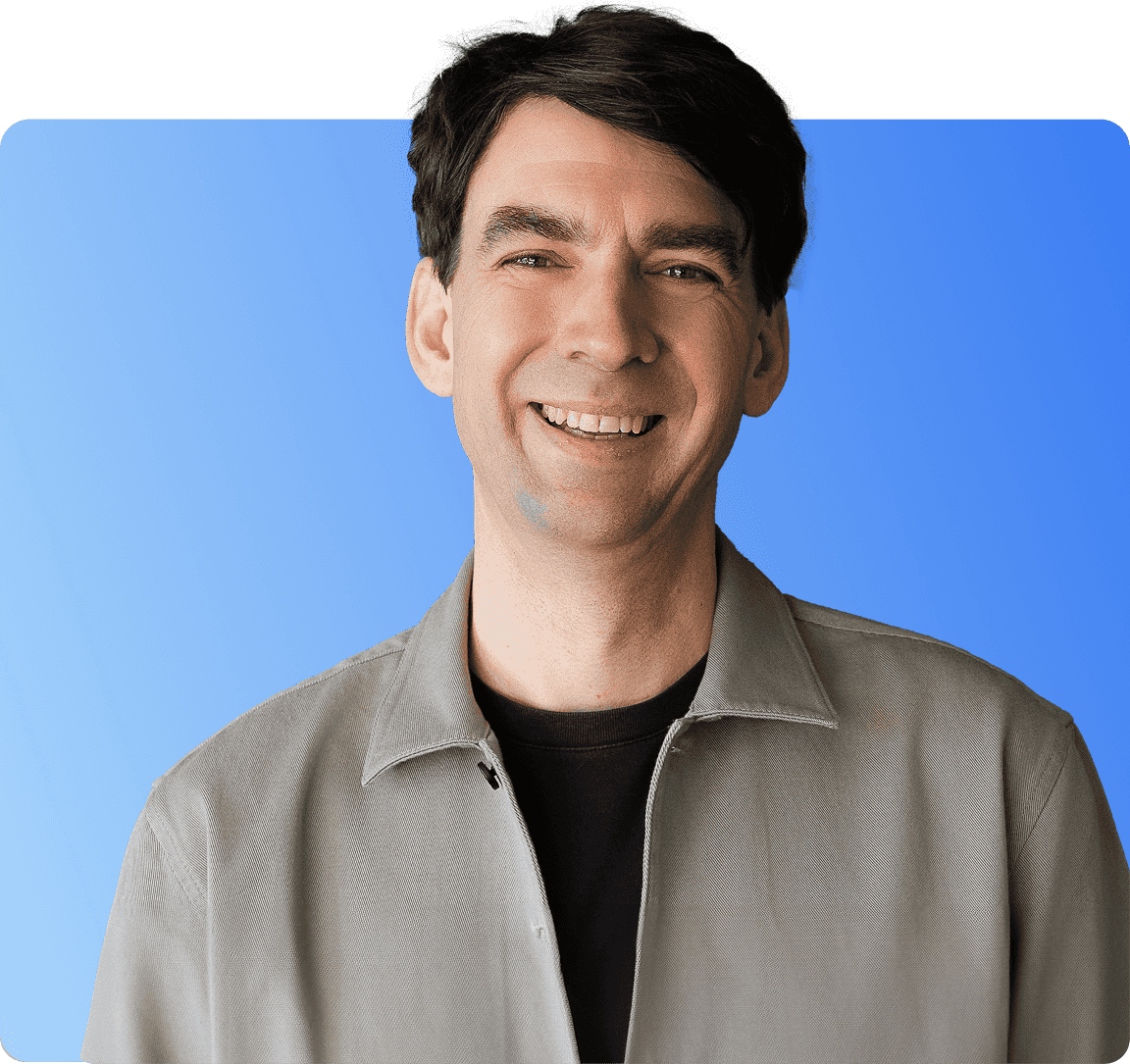 Matthias 'Matze' Henze, CEO and founder of Jimdo, wearing a brown flat cap and light blue shirt, smiling warmly at the camera, against a light purple background.